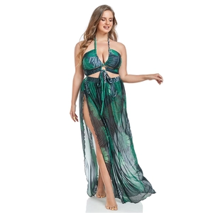 Detail of high slit mesh skirt with tropical palm leaf print for beachwear set