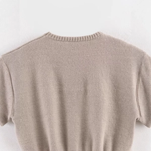 Oatmeal knit sleeveless top featuring a fine ribbed crew neck and soft texture