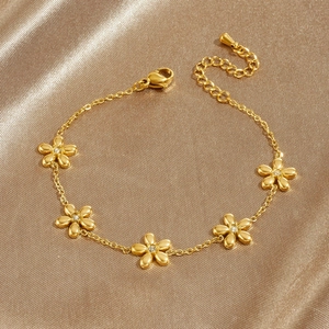 Gold plated stainless steel floral bracelet with sparkling zircon flower charms and lobster clasp