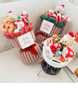 Christmas plush doll bouquet detail showing cute cartoon toys and bright warm LED lights.