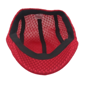 Internal view of red mesh newsboy cap showing the size 58 label and sweatband detail