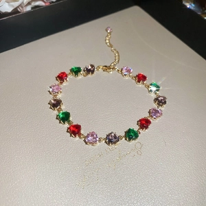 Colorful heart gemstone bracelet with gold-plated chain and adjustable lobster clasp closure