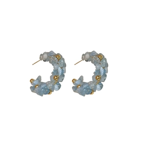 Light blue beaded C-shaped hoop earrings with gold metal accents and silver pins