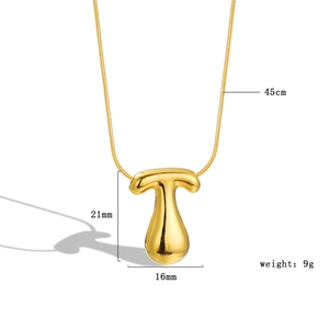Macro shot of 18k gold plated bubble letter T pendant with size 21x16mm and 45cm chain