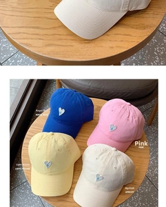 Close-up and collection of breathable cotton baseball caps with heart letter embroidery