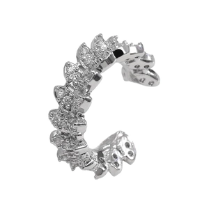 Macro shot of silver C-shaped ear cuff with leaf motifs and shimmering zircon stones