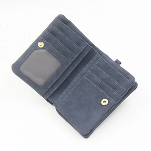 Detail view of the blue matte wallet interior with card slots and a clear photo window