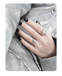 Close-up of S925 sterling silver hollow rings with a baroque pearl on a model's finger