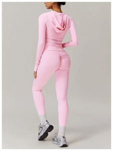 Detail view of pink yoga set with scrunch butt lifting leggings and hooded crop top