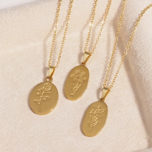 Gold titanium steel oval necklaces featuring engraved rose, daisy, and lily pendants