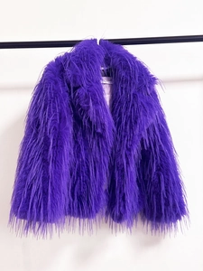 Detailed view of deep purple faux fur texture and large lapel on the cropped coat