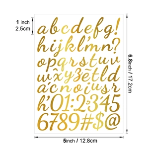 Detail of 1-inch gold metallic alphabet and number stickers with dimension markings
