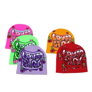 Five assorted knit beanies featuring LOVER GIRL text with cherry and heart motifs