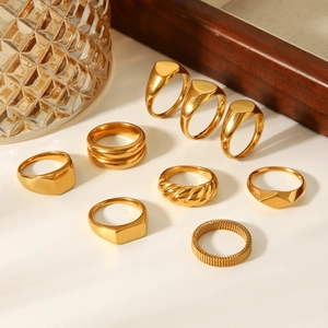 Minimalist 18k gold plated stainless steel geometric rings set displayed on a white surface