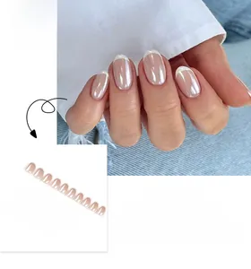 Detail of French tip press-on nails with pearl luster finish and white borders