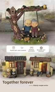 Detailed resin figurines of an elderly couple in garden and traditional house scenes