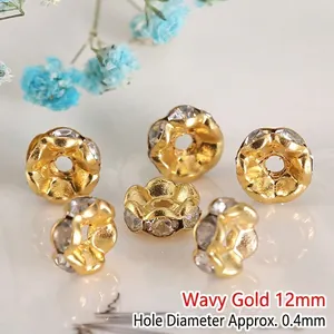 Close-up of 12mm wavy golden spacer beads with rhinestones and 0.4mm hole for DIY jewelry