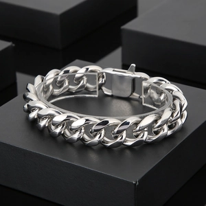 Detailed view of a 15mm silver Cuban link bracelet with a secure metal buckle clasp