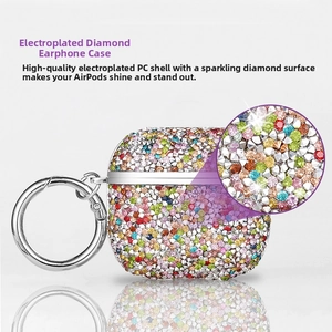 Macro shot of colorful rhinestones on plated PC case for AirPods with metal keychain