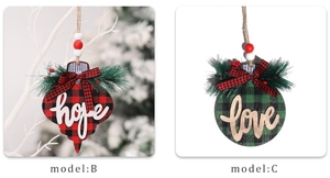 Detail of wooden Christmas ornaments with hope and love text in plaid patterns