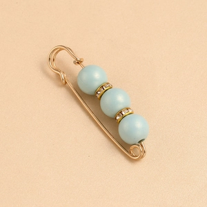 Light blue macaron waist brooch with gold pins and three decorative round beads