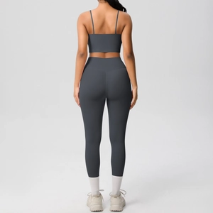 Back view of dark grey seamless yoga set with thin strap crop top and leggings