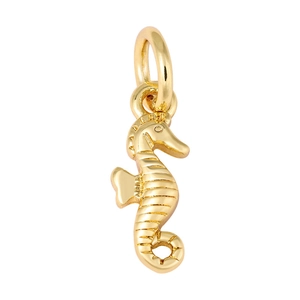 Macro detail of golden seahorse pendant with sparkling cubic zirconia and glossy finish