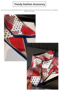 Detailed texture of a red and blue polka dot silk scarf displayed in a premium gift box
