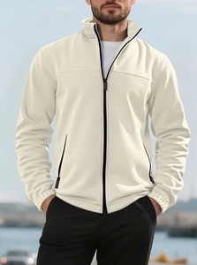 Outdoor shot of men fleece jacket in cream beige with stand collar and zipper detail
