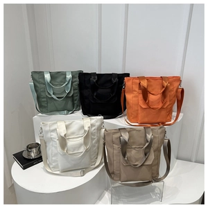 Detailed arrangement of high-capacity nylon tote bags in five stylish assorted colors