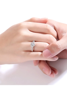 Close-up of heart-shaped moissanite ring worn on hand for engagement jewelry gift