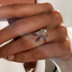 Macro shot of rose gold butterfly ring featuring hollow design and micro-pave zircons