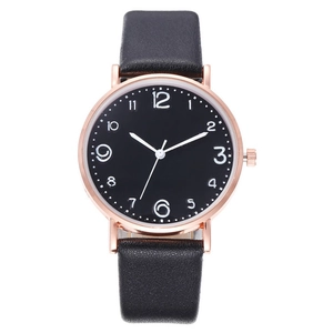 Front view of a minimalist round watch with black dial and rose gold case on white background