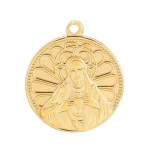 Detailed view of a golden stainless steel pendant with embossed Virgin Mary motif