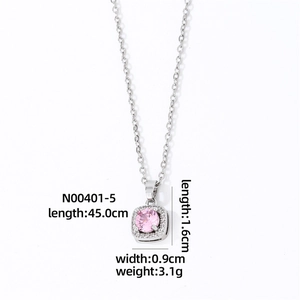 Detail of silver square pendant necklace featuring a pink gemstone and micro-pavé zircons