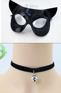 Detail of black cat ear mask in faux leather and choker with silver bell accessory