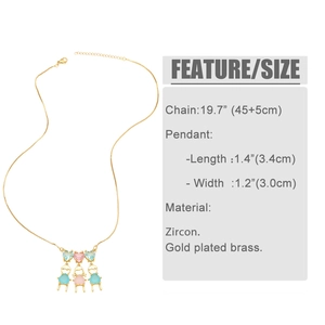 Detail of gold-plated necklace featuring zircon heart pendants and boy-girl charms