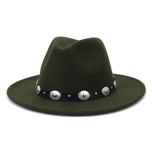 Close-up of silver engraved metal studs and black belt on dark green wool felt hat