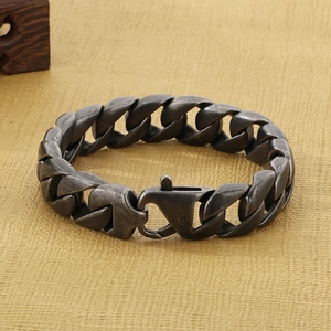 Macro detail of 15mm heavy Cuban link chain bracelet in vintage silver stainless steel