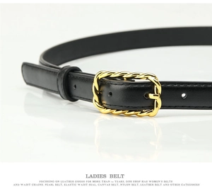 Close-up of black PU leather belt featuring a detailed gold twisted texture metal buckle