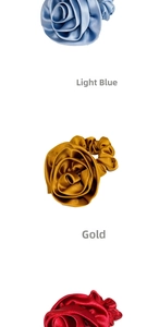 Detail view of satin rose hair scrunchies in light blue, gold and red colors