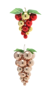 Detail of grape-shaped Christmas ornaments in red, gold and rose gold with green leaf top