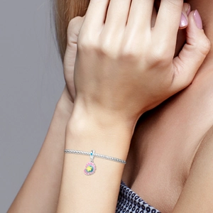 Detailed view of colorful seashell charm in S925 silver with vibrant enamel and star detail