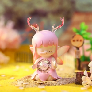Detail of pink deer elf ornament with glitter ball in a soft miniature forest setting