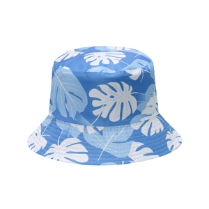 Detail of tropical monstera leaf print on light blue sun bucket hat for summer beach