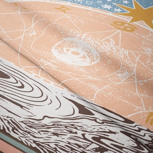Macro shot of boho moon phase tapestry fabric with zodiac symbols and textile texture