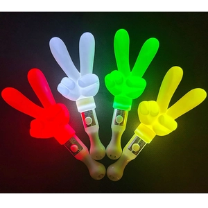 Detail of four LED gesture glow sticks in red, white, green, and yellow light colors