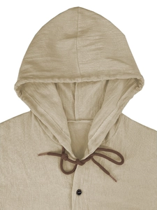 Detail view of khaki cotton linen hoodie neckline with dark brown drawstring and button