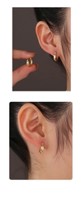 Detailed view of minimalist 14K gold double-layered hoop earrings for women