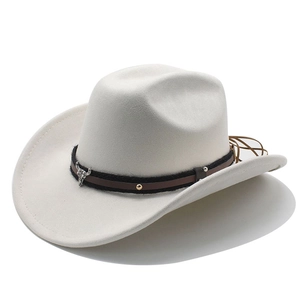 Close-up of white felt cowboy hat with leather band and bull head metal ornament
